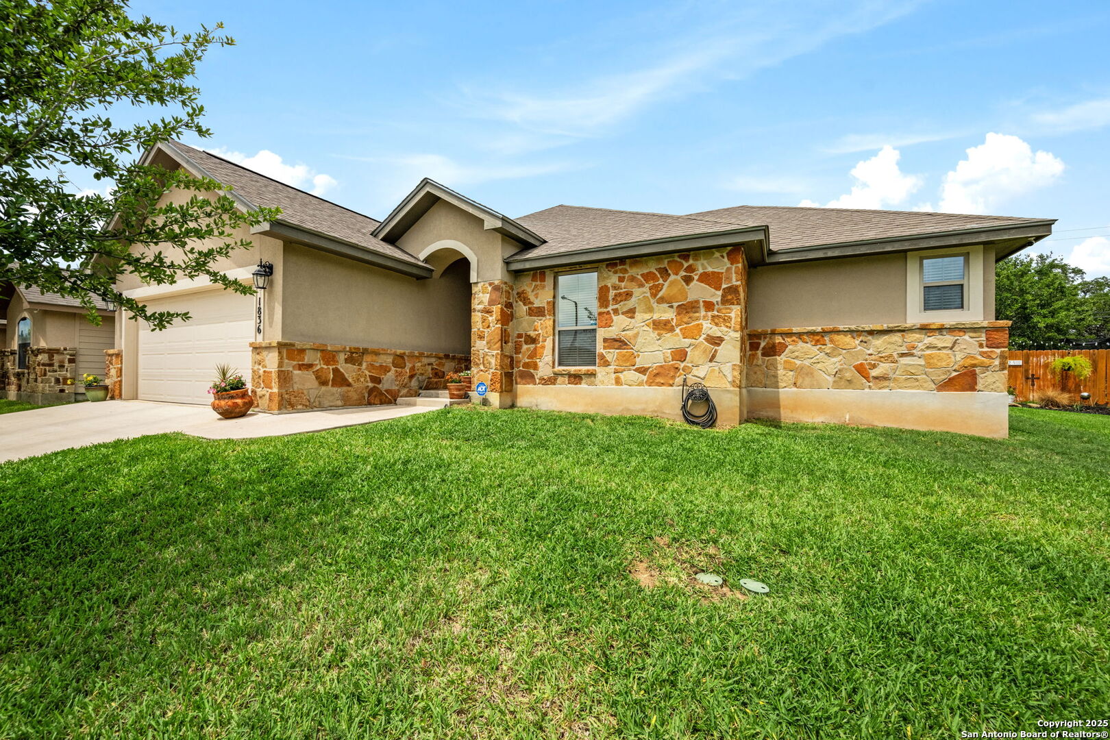 a front view of a house with garden