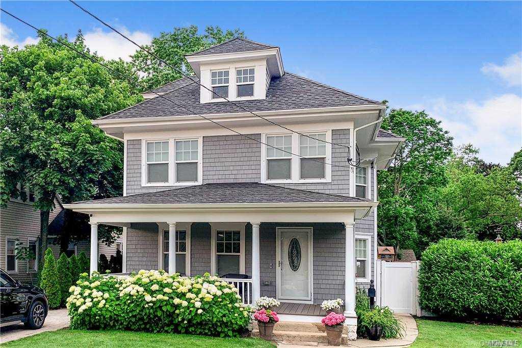 a front view of a house with yard