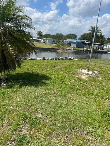 a backyard of a house with yard and garage