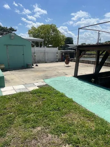 a view of a lake with houses in the back