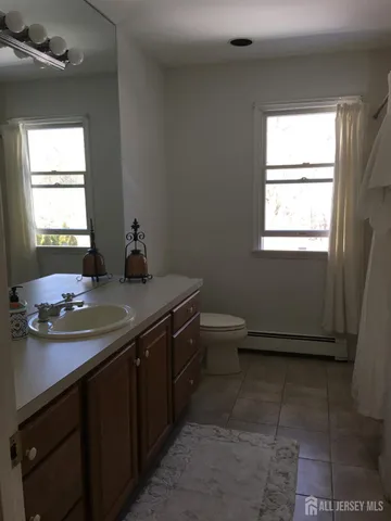 a bathroom with a sink a vanity and a mirror
