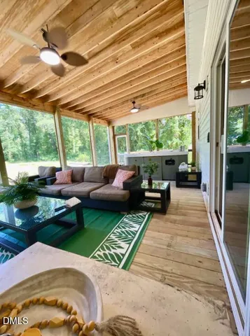 a spacious bathroom with a sink a mirror and bathtub