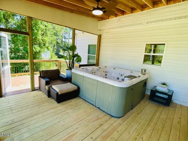 a bedroom with furniture and a window