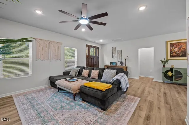 a living room with furniture a chandelier