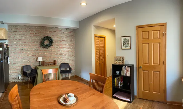 a bedroom with a bed and a table in it