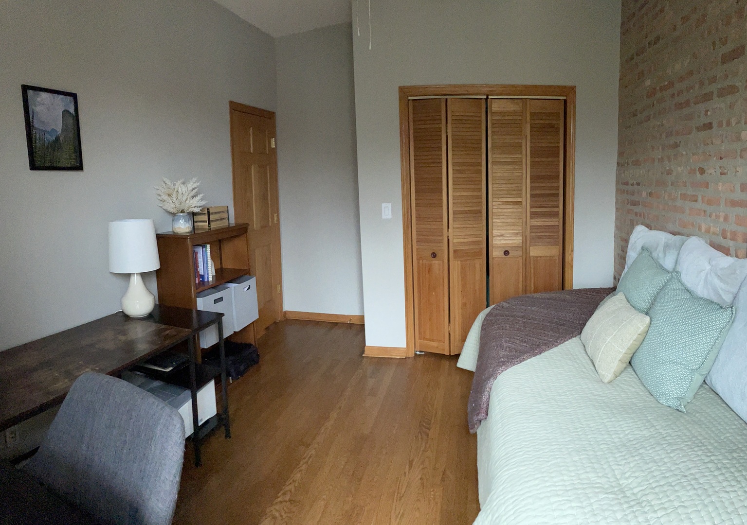 2755 West Logan Boulevard, Unit 2 Chicago, IL 60647 - Photo 17 of 24 a bedroom with a bed and wooden floor