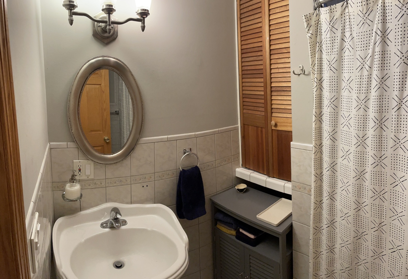 2755 West Logan Boulevard, Unit 2 Chicago, IL 60647 - Photo 18 of 24 a bathroom with a sink a toilet and a mirror