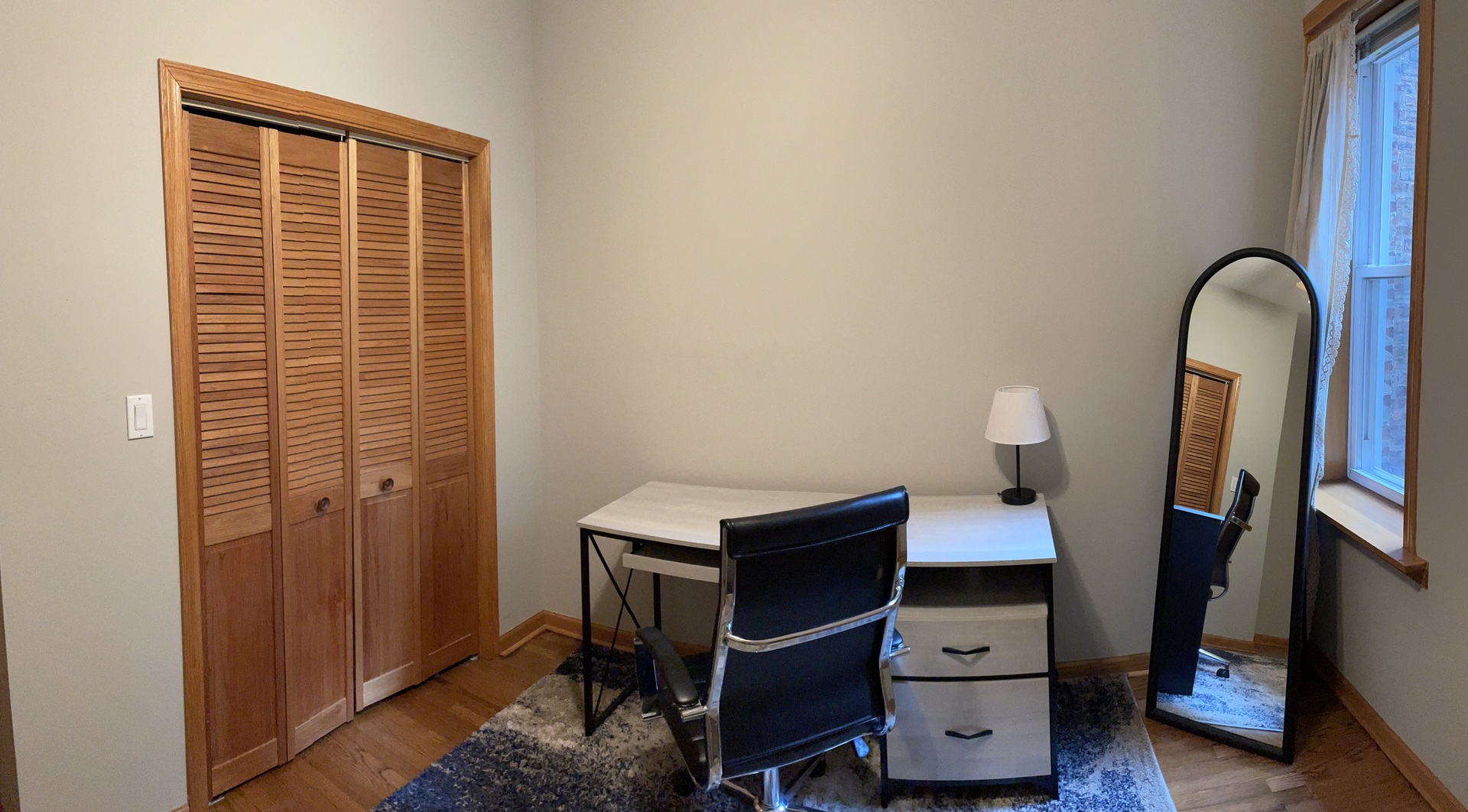 2755 West Logan Boulevard, Unit 2 Chicago, IL 60647 - Photo 22 of 24 a view of a workspace with furniture and wooden floor