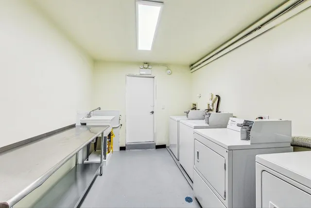 a view of storage and utility room with washer and dryer