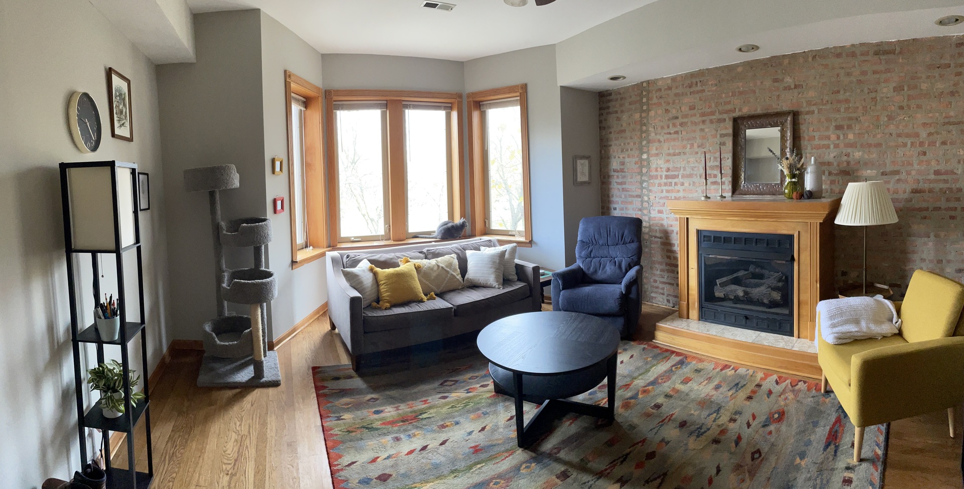 2755 West Logan Boulevard, Unit 2 Chicago, IL 60647 - Photo 3 of 24 a living room with furniture fireplace and a table