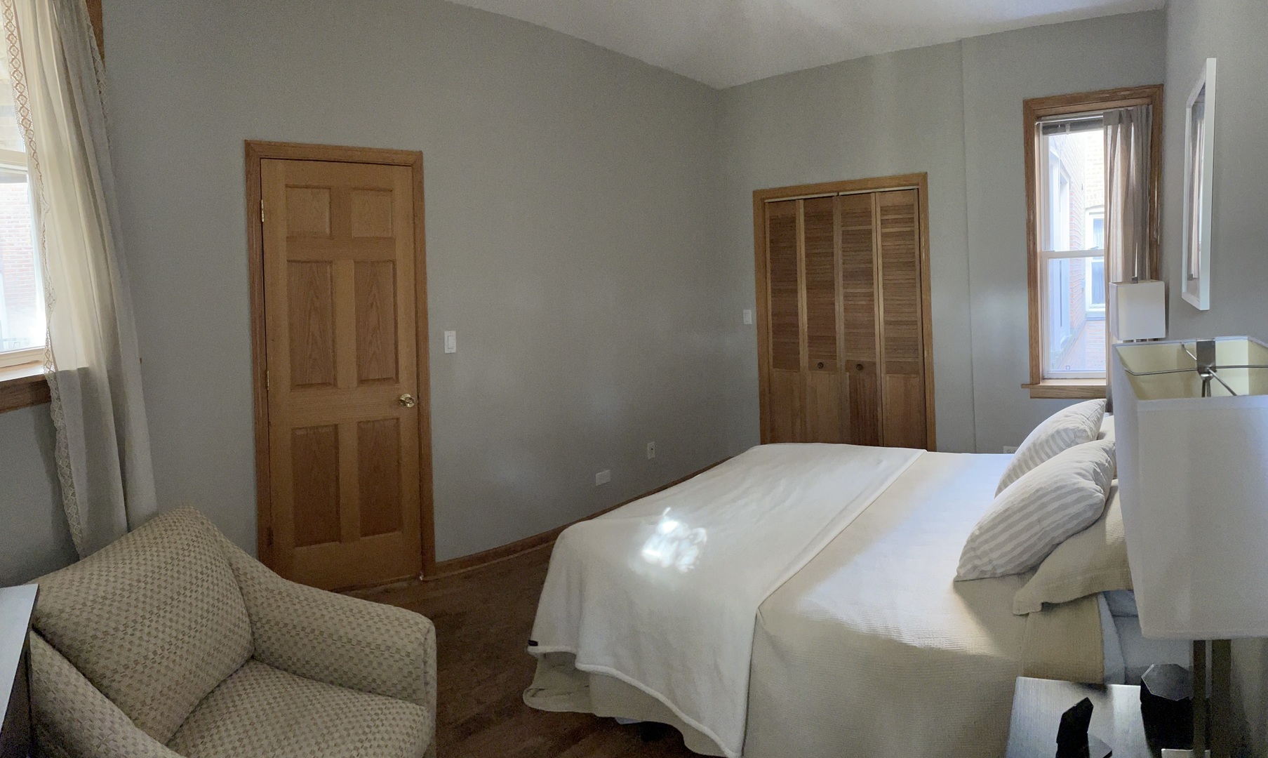 2755 West Logan Boulevard, Unit 2 Chicago, IL 60647 - Photo 6 of 24 a bedroom with a bed and a couch