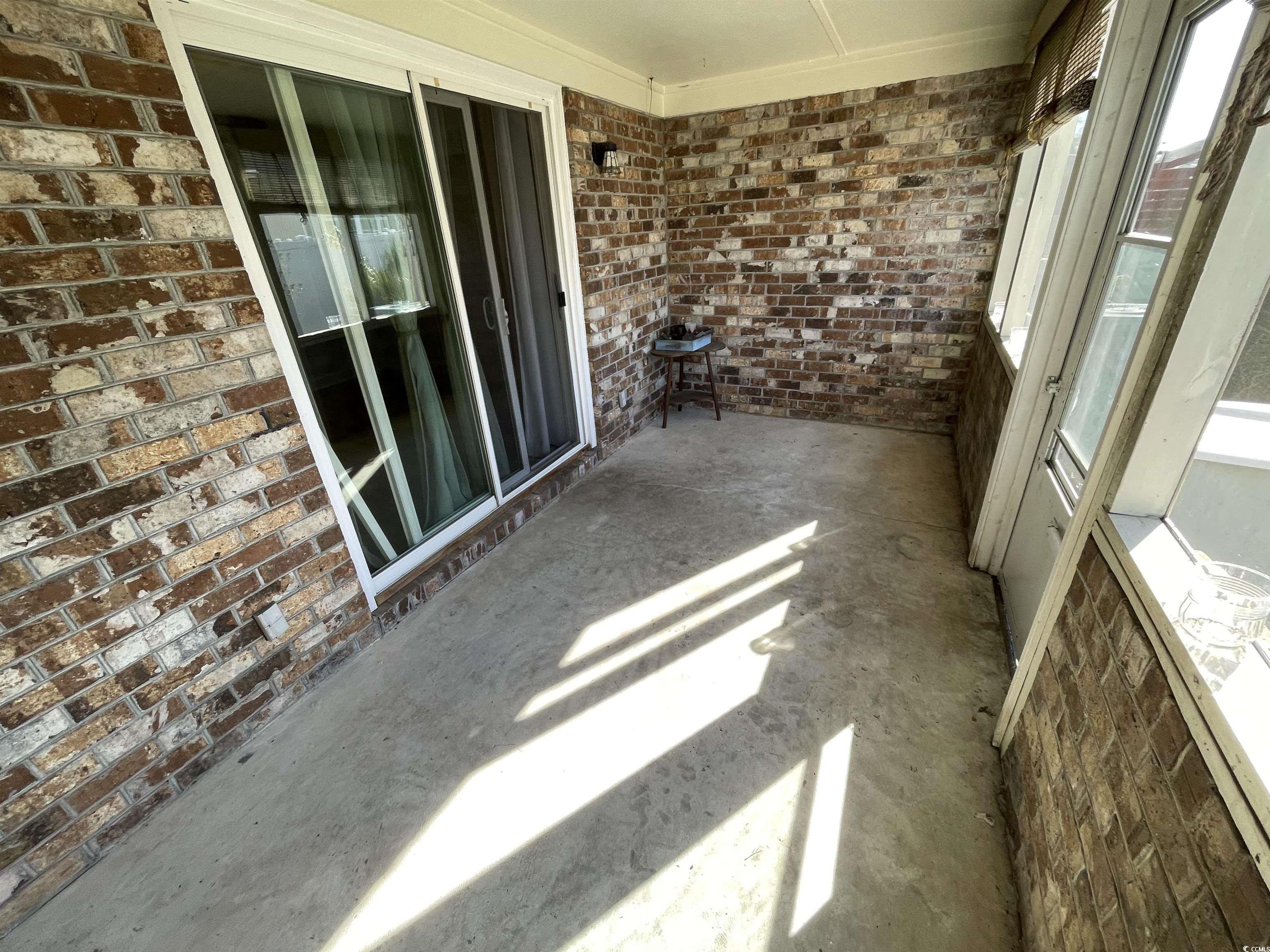 1851 Fairway Ridge Drive, Unit 7E Surfside Beach, SC 29575 - Photo 25 of 29 View of unfurnished sunroom