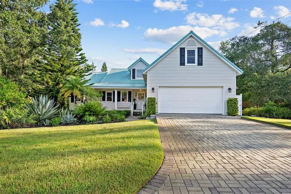 a front view of a house with yard