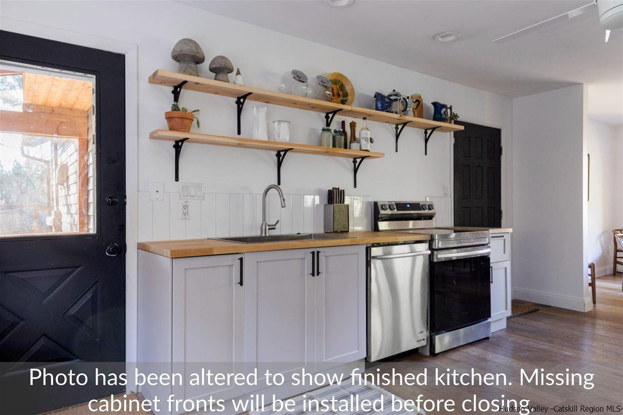 1882 County Road Olivebridge, NY 12461 - Photo 15 of 35 a kitchen with stainless steel appliances granite countertop a sink and cabinets