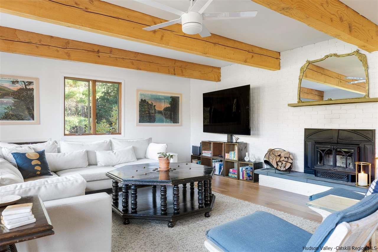 1882 County Road Olivebridge, NY 12461 - Photo 5 of 35 a living room with furniture a fireplace and a flat screen tv