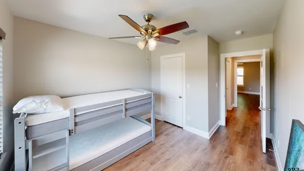 a view of livingroom with hardwood floor and ceiling fan