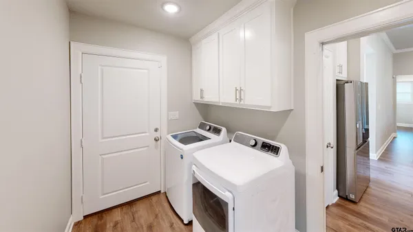 a view of storage and utility room with a washer and dryer