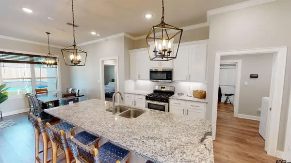 a kitchen island with furniture and wooden floor
