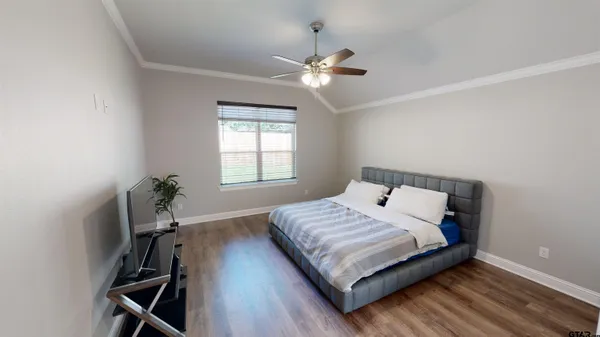 a bedroom with a bed and window