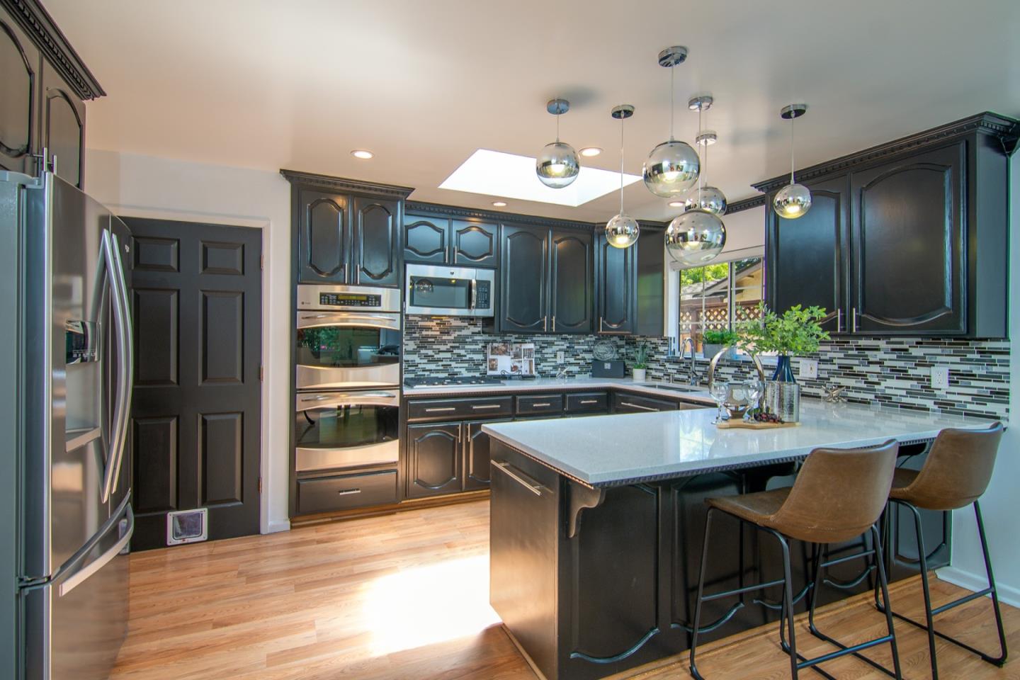 535 Sobrato Drive Campbell, CA 95008 - Photo 14 of 32 a kitchen with a sink and stainless steel appliances
