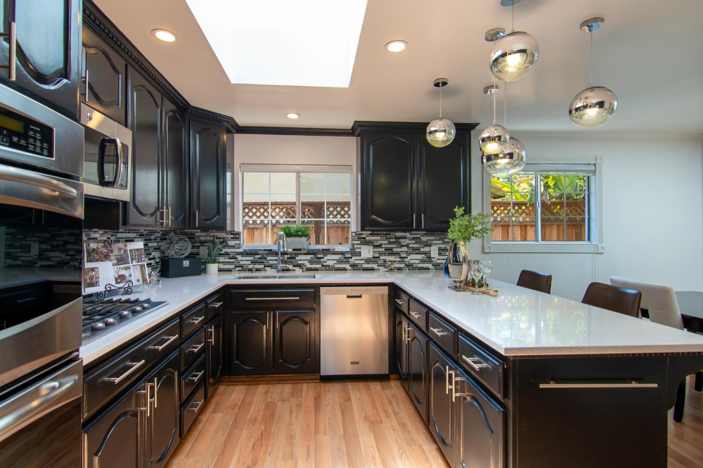 535 Sobrato Drive Campbell, CA 95008 - Photo 15 of 32 a kitchen with stainless steel appliances granite countertop sink stove top oven and cabinets