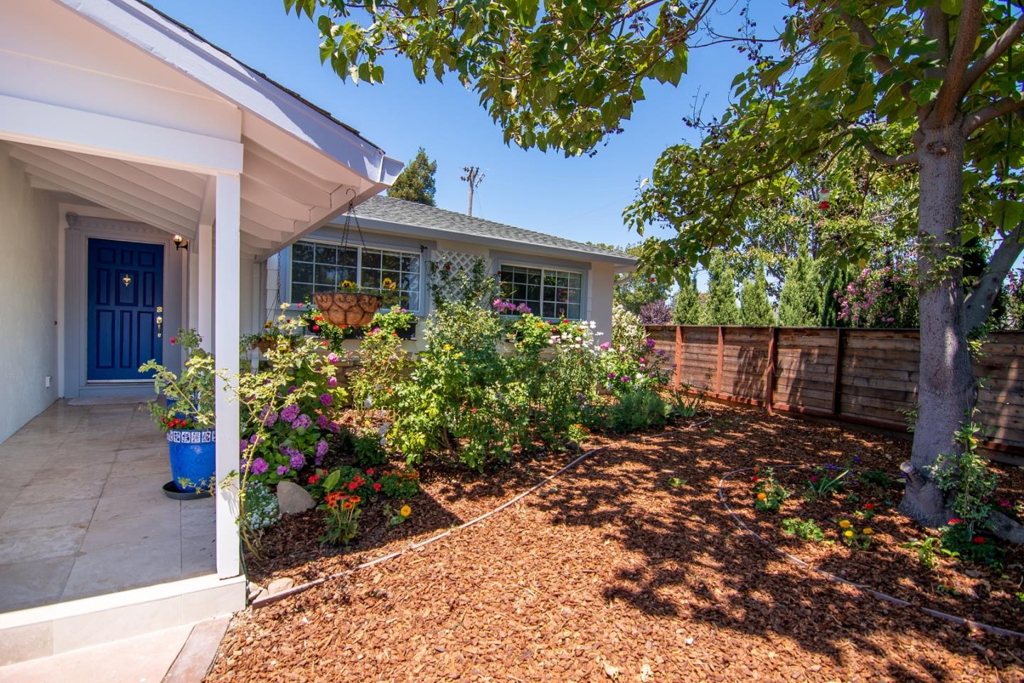 535 Sobrato Drive Campbell, CA 95008 - Photo 2 of 32 a front view of a house with a garden