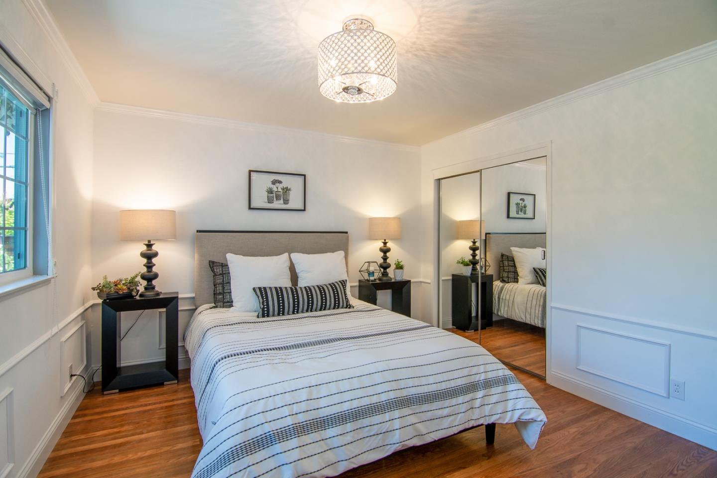 535 Sobrato Drive Campbell, CA 95008 - Photo 21 of 32 a bedroom with a bed and wooden floor