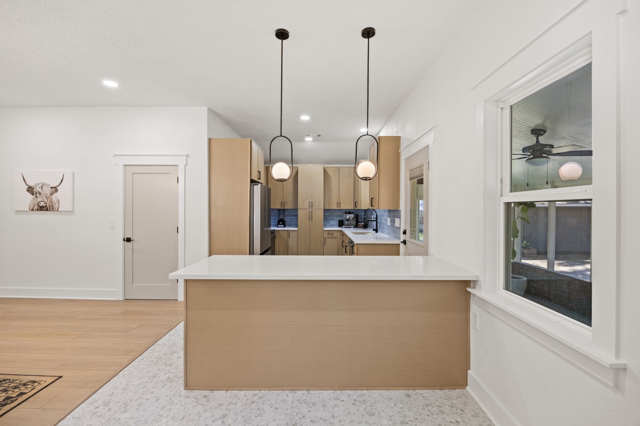 2693 Fairview Road Alvin, TX 77511 - Photo 12 of 49 a view of a kitchen with kitchen island a counter top space and stainless steel appliances