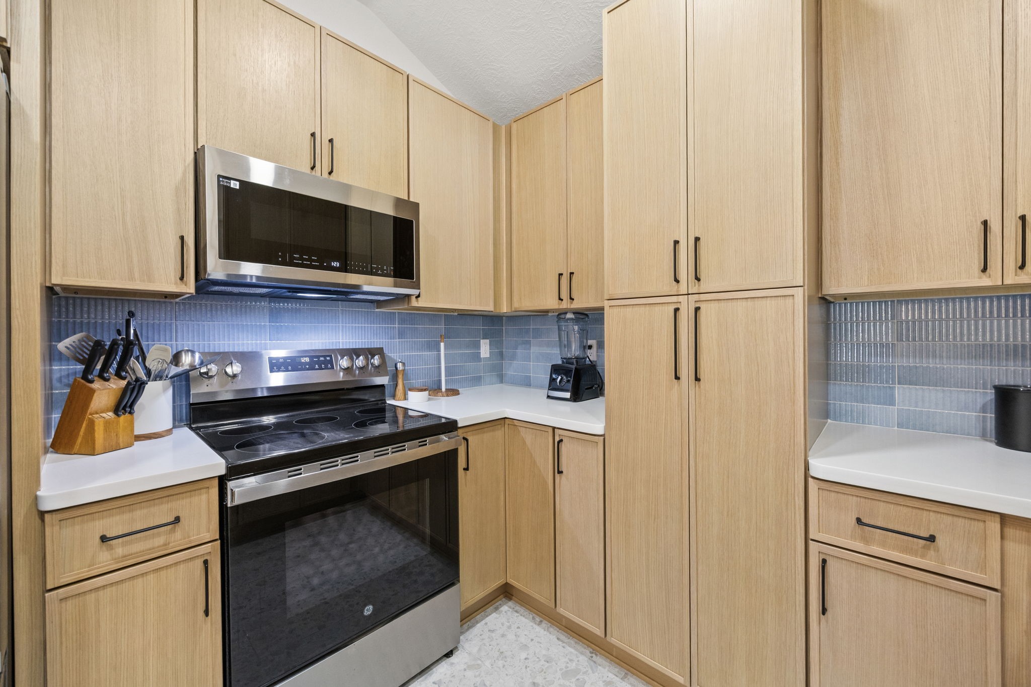 2693 Fairview Road Alvin, TX 77511 - Photo 14 of 49 a kitchen with wooden cabinets and a stove top oven