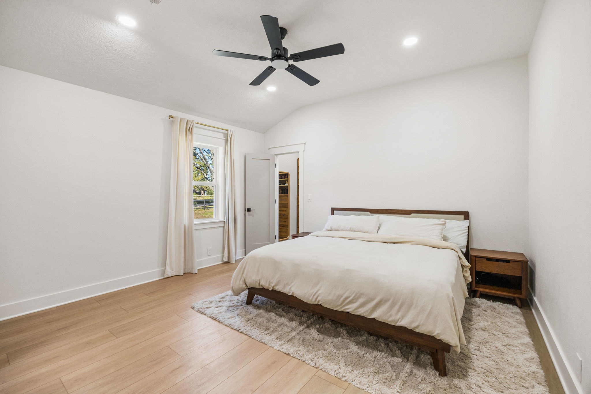 2693 Fairview Road Alvin, TX 77511 - Photo 17 of 49 a bedroom with a bed and a ceiling fan