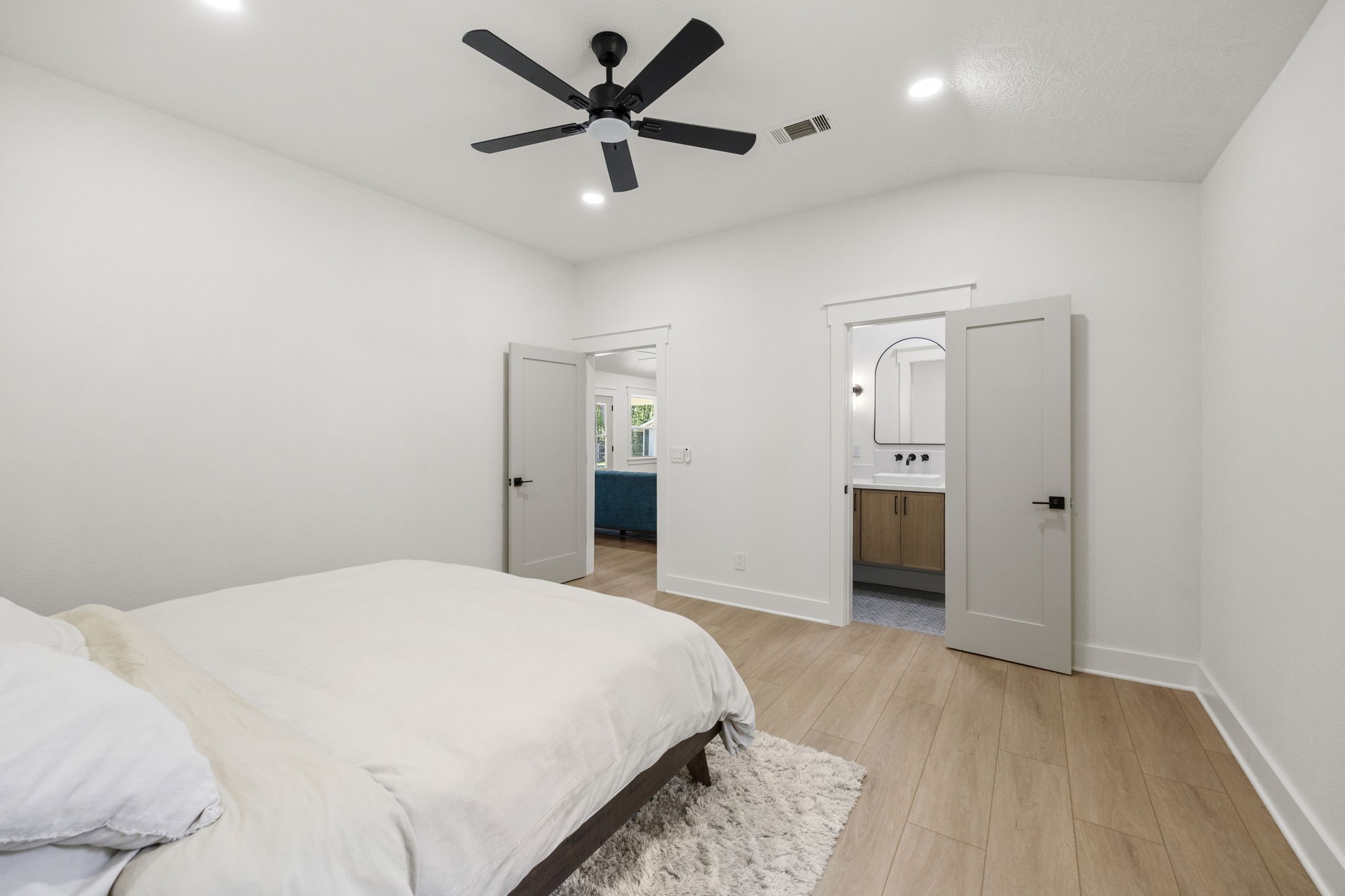 2693 Fairview Road Alvin, TX 77511 - Photo 18 of 49 a bedroom with a large bed and a chandelier