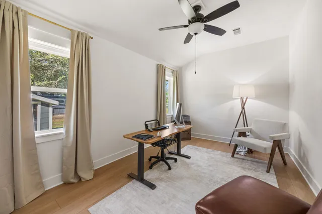 a room with gym equipment and windows