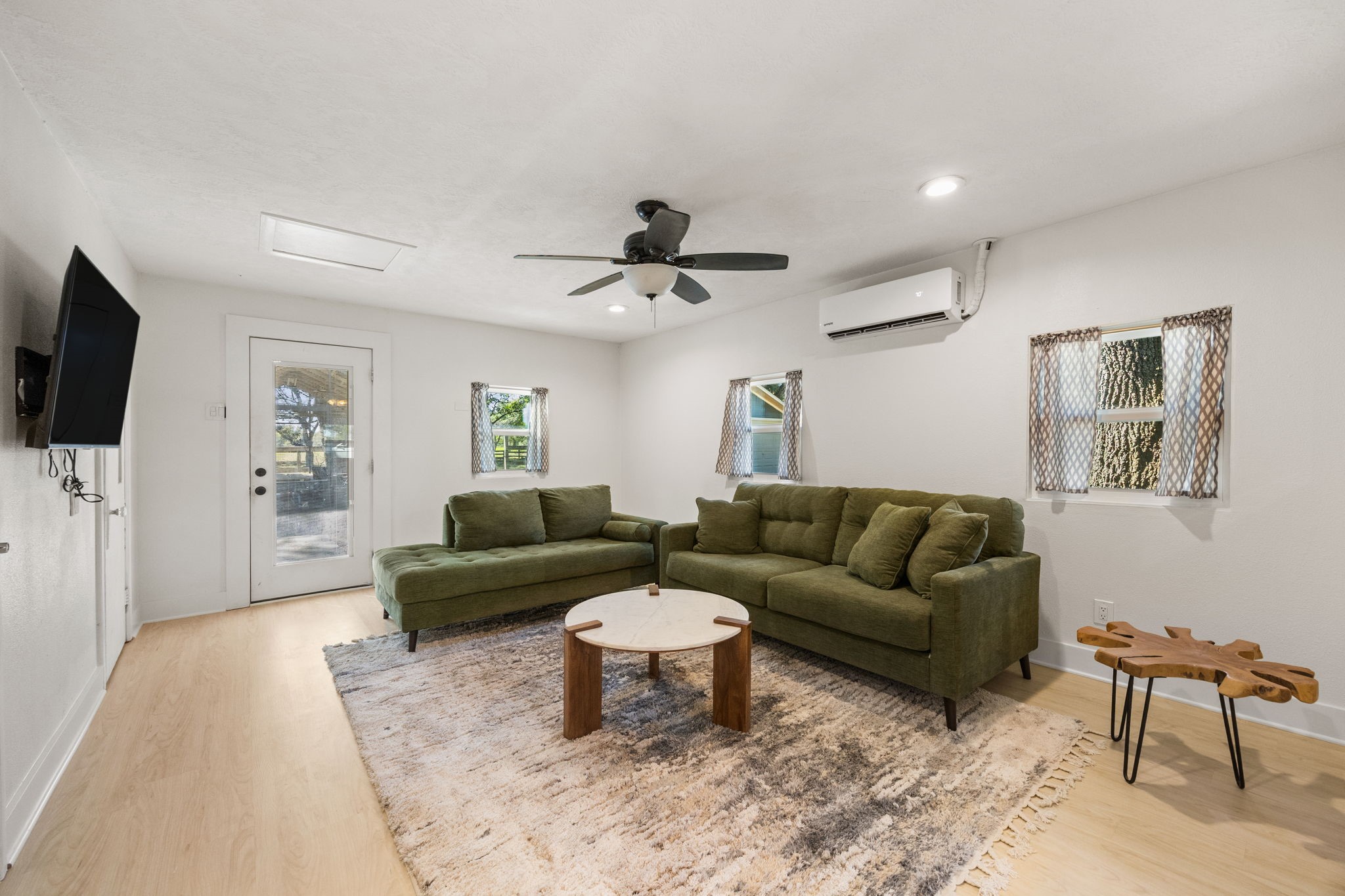 2693 Fairview Road Alvin, TX 77511 - Photo 28 of 49 a living room with furniture and a flat screen tv