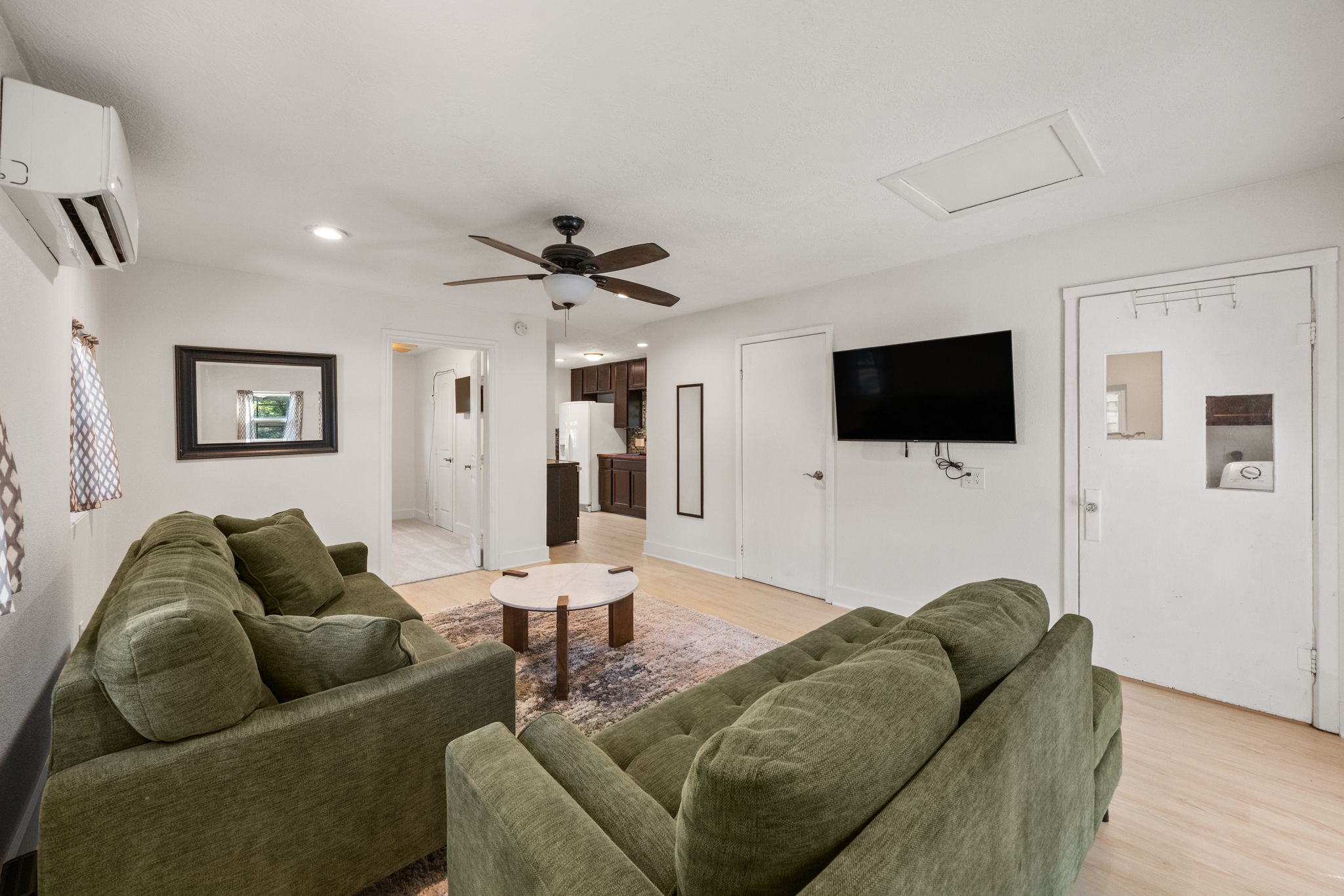 2693 Fairview Road Alvin, TX 77511 - Photo 29 of 49 a living room with furniture and a flat screen tv