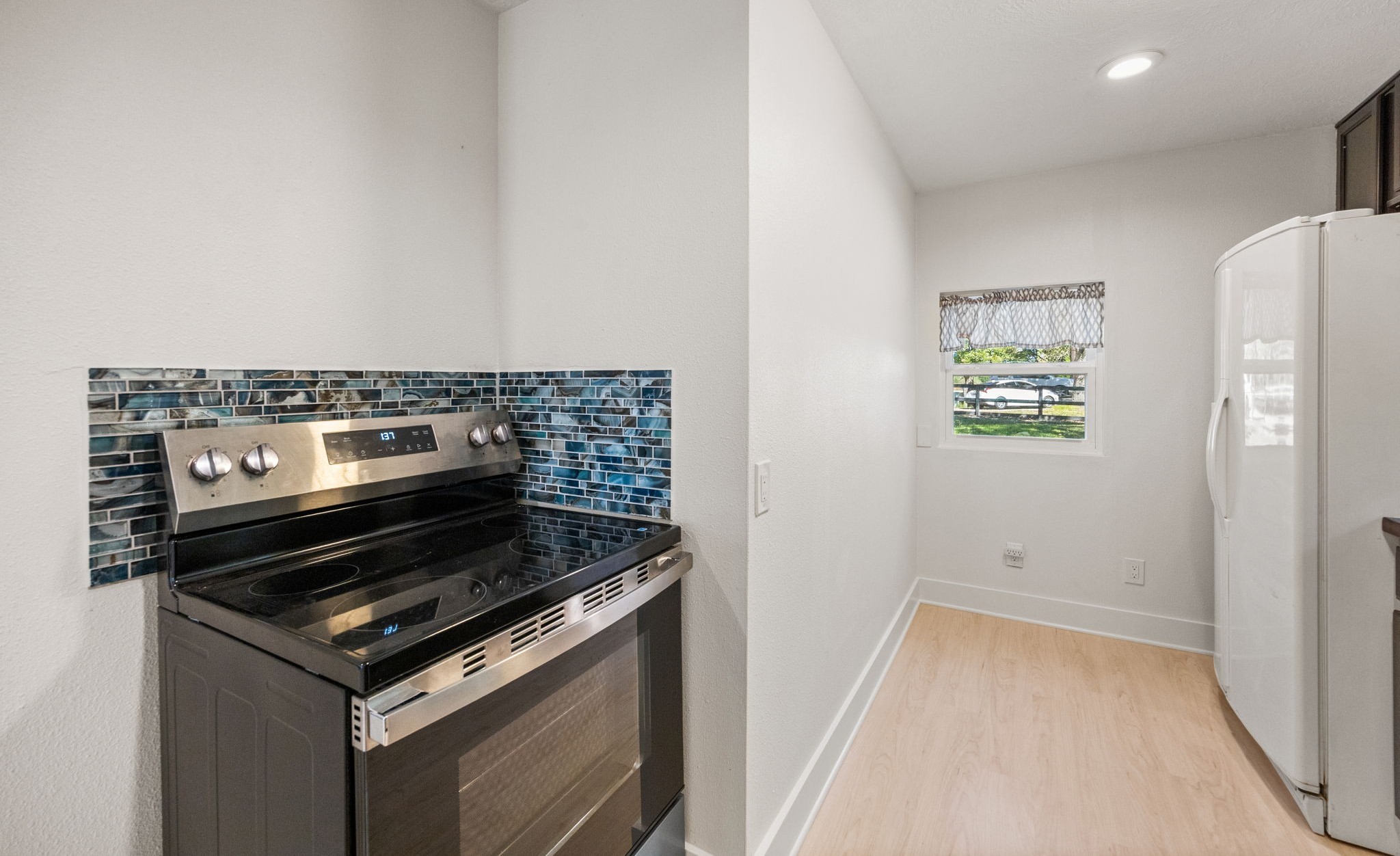 2693 Fairview Road Alvin, TX 77511 - Photo 31 of 49 a stove top oven sitting inside of a kitchen