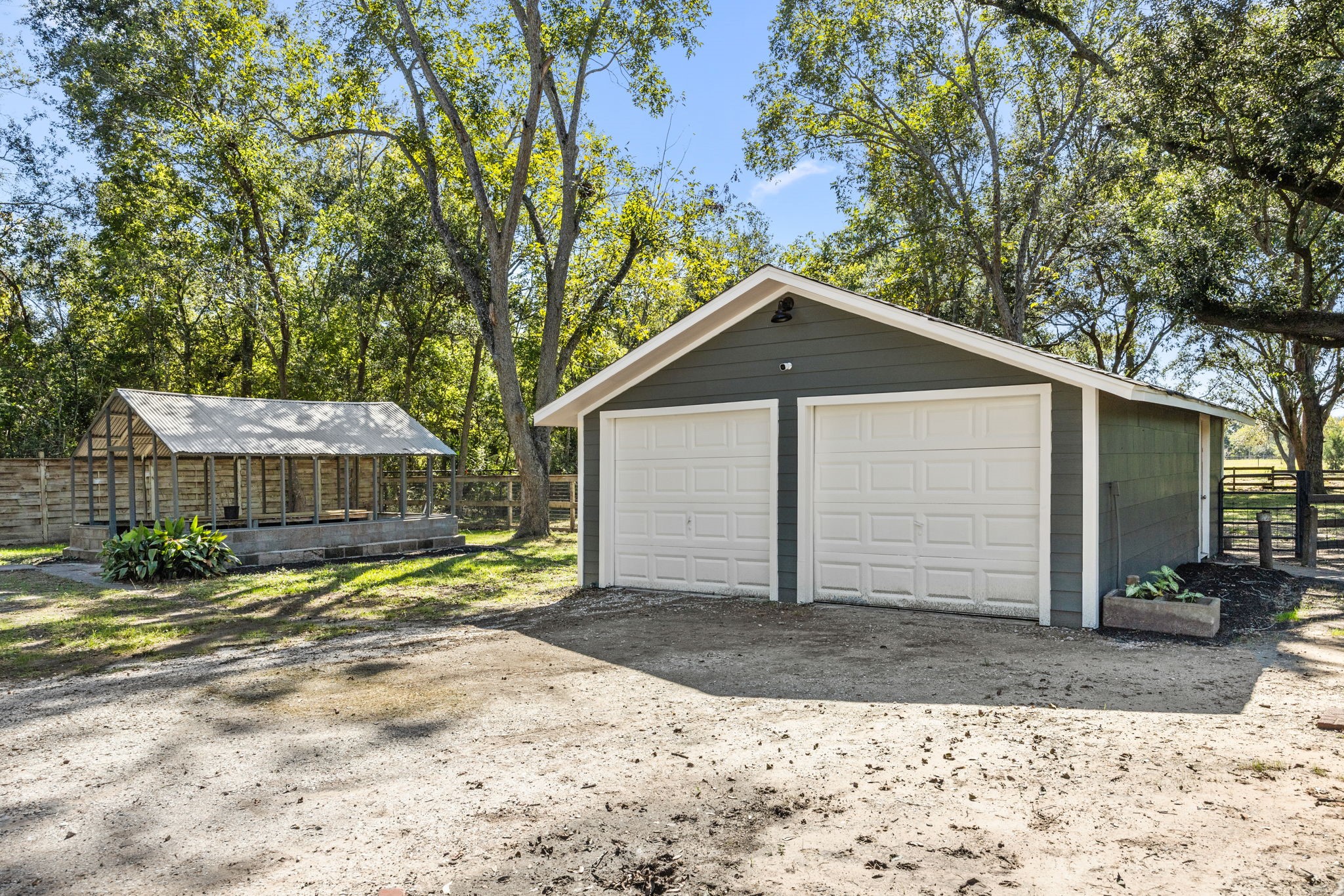 2693 Fairview Road Alvin, TX 77511 - Photo 35 of 49 a view of a house with a yard and large tree