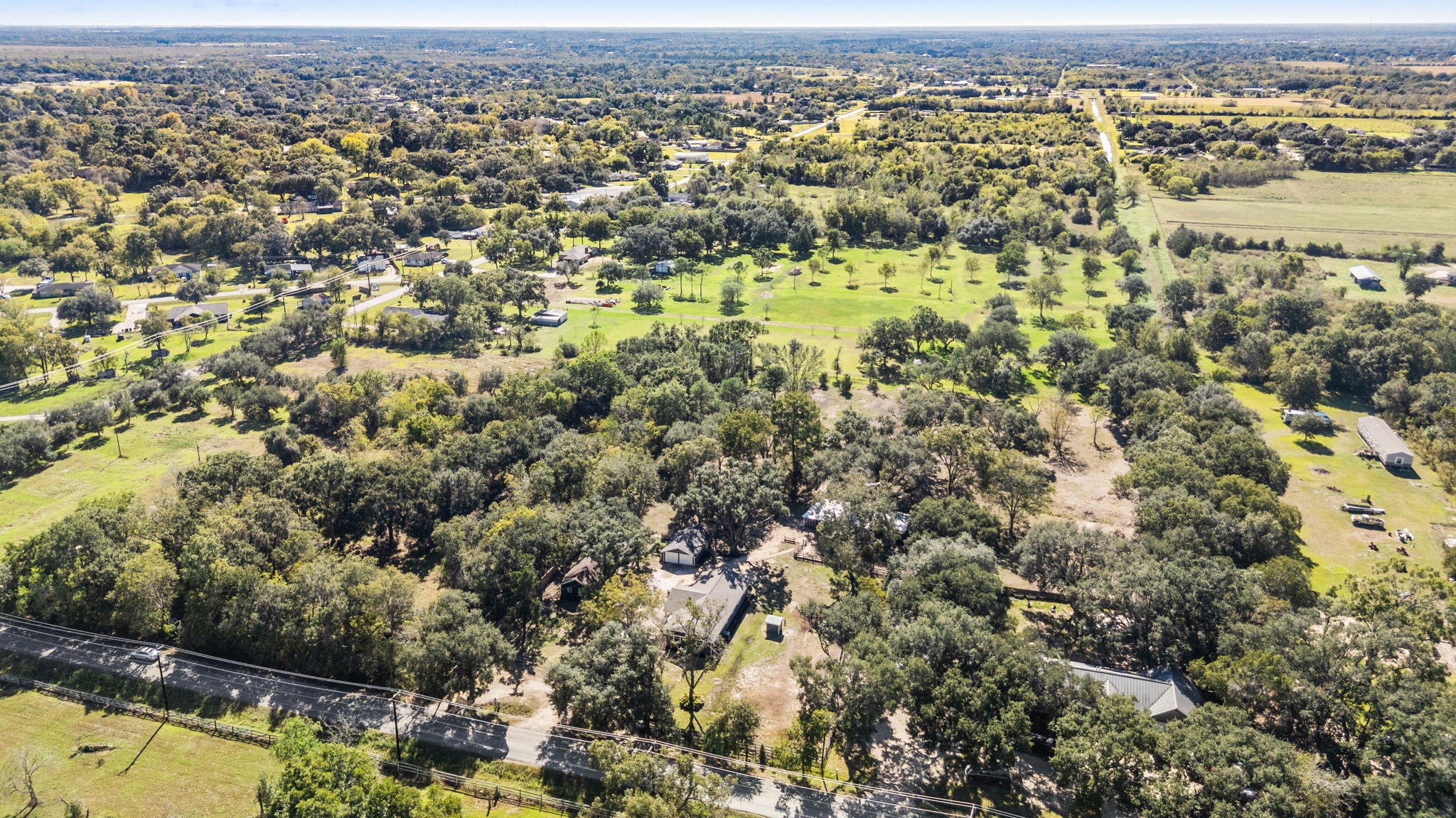 2693 Fairview Road Alvin, TX 77511 - Photo 47 of 49 an aerial view of residential houses with outdoor space and trees