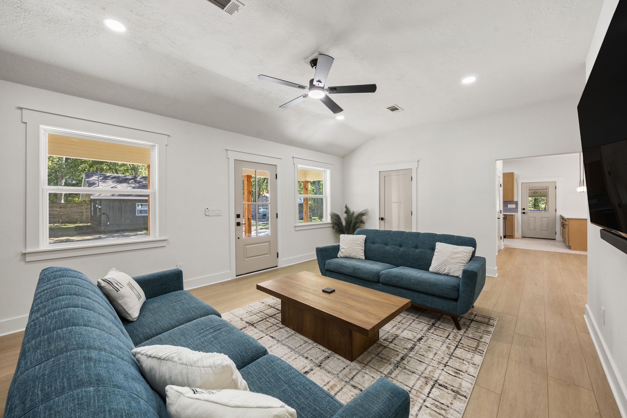 2693 Fairview Road Alvin, TX 77511 - Photo 5 of 49 a living room with furniture and a flat screen tv