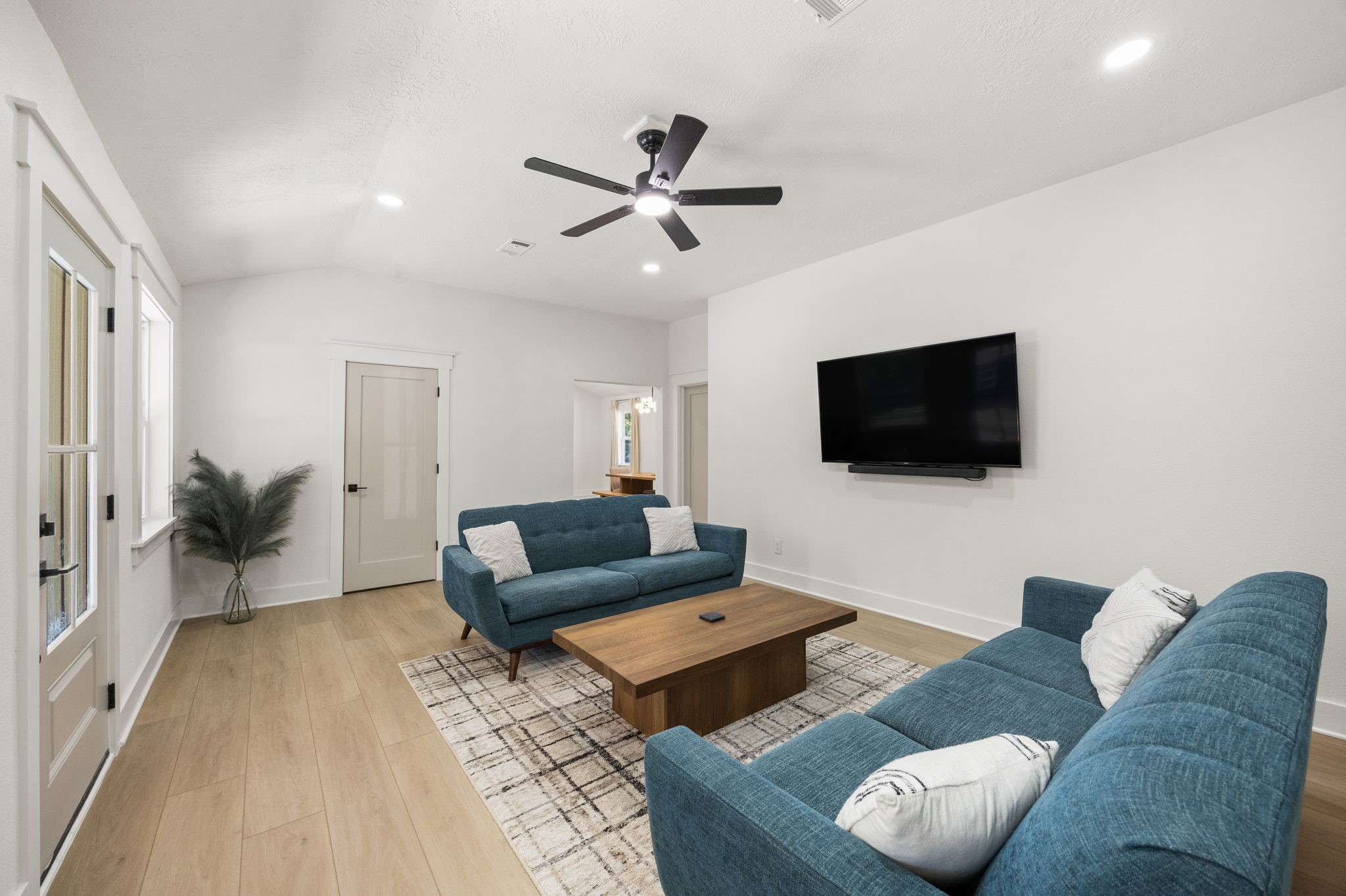 2693 Fairview Road Alvin, TX 77511 - Photo 6 of 49 a living room with furniture and a flat screen tv