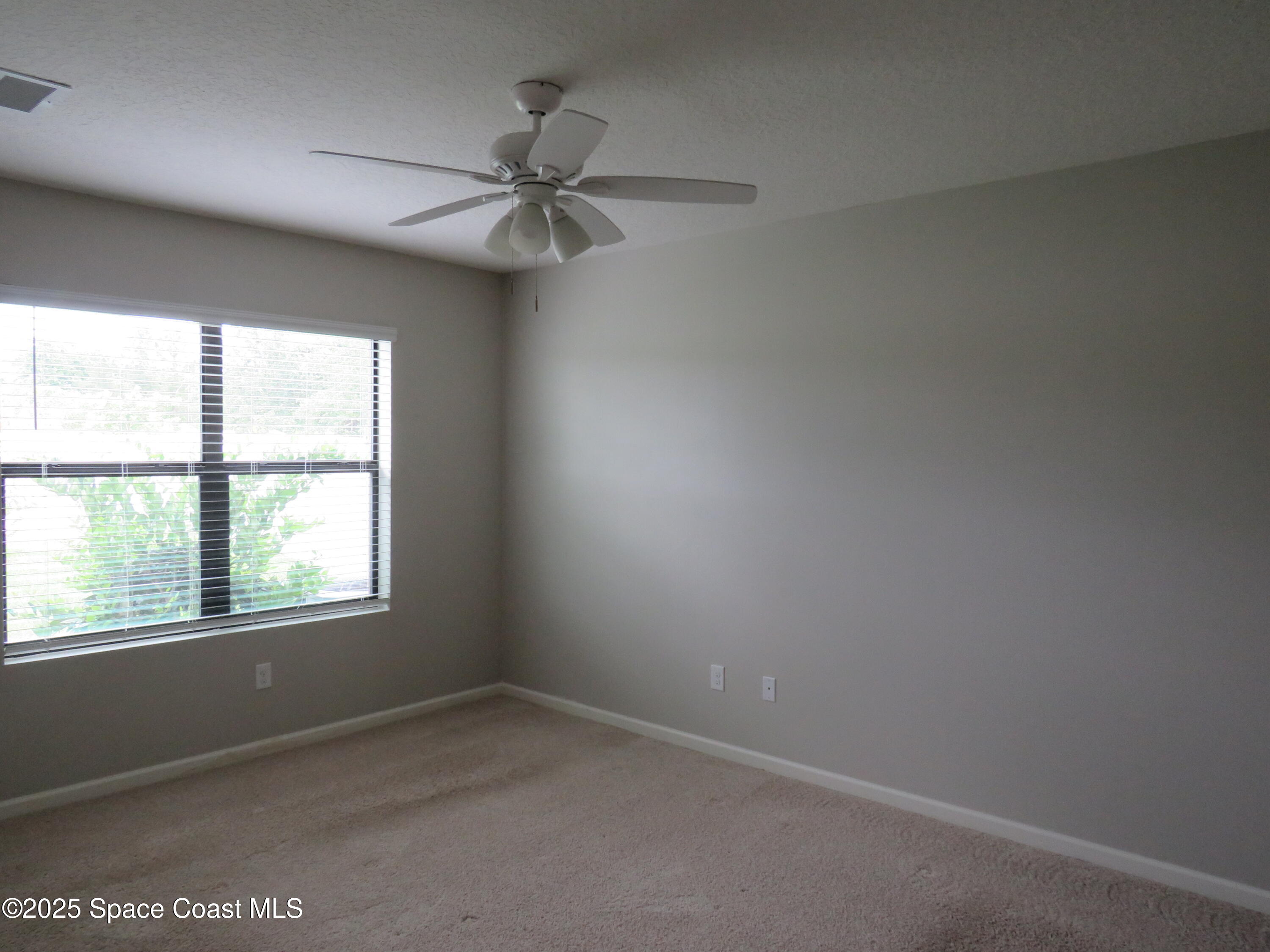 3548 Loggerhead Lane Mims, FL 32754 - Photo 13 of 25 an empty room with a window