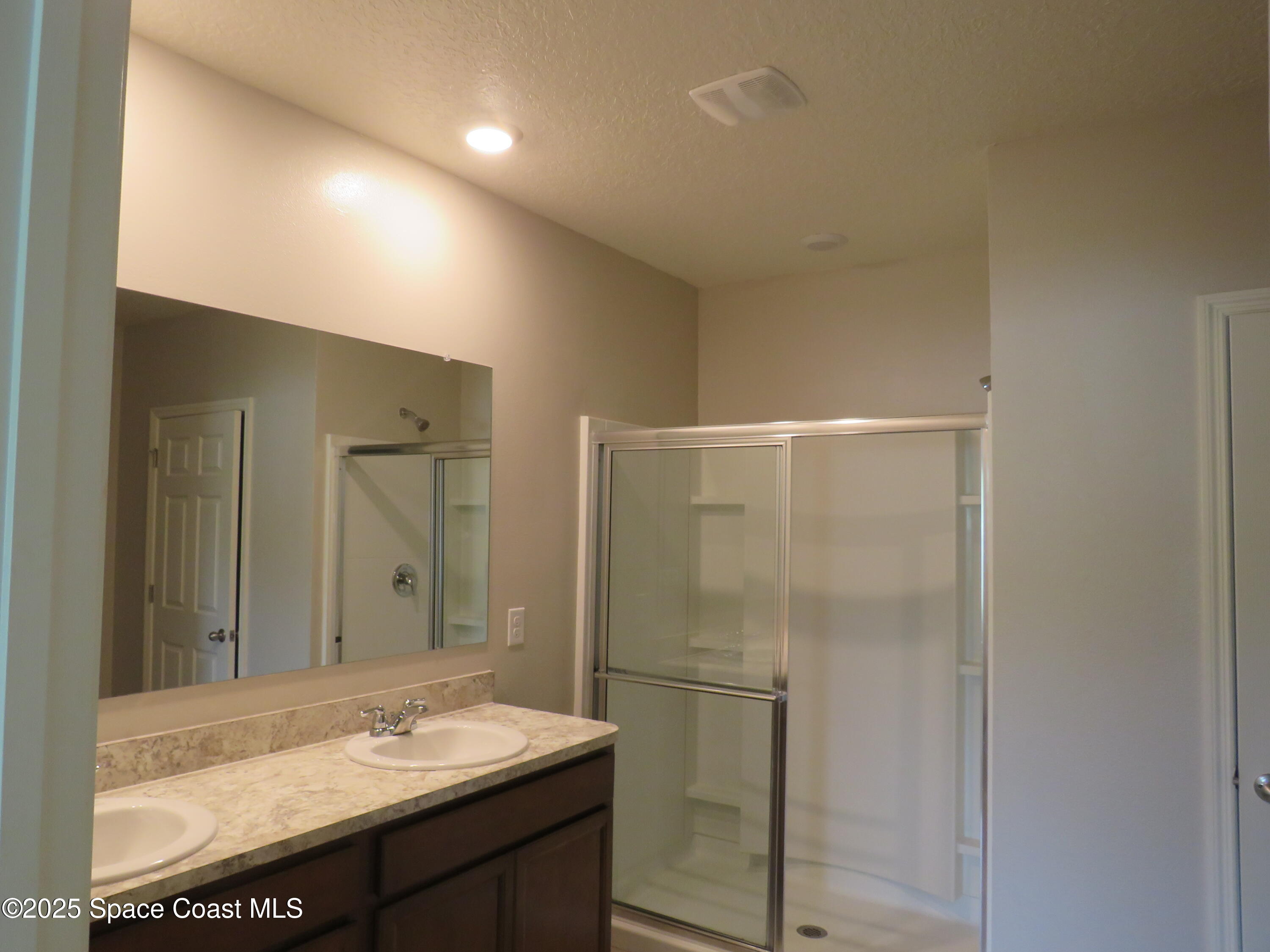 3548 Loggerhead Lane Mims, FL 32754 - Photo 14 of 25 a bathroom with a sink and a mirror