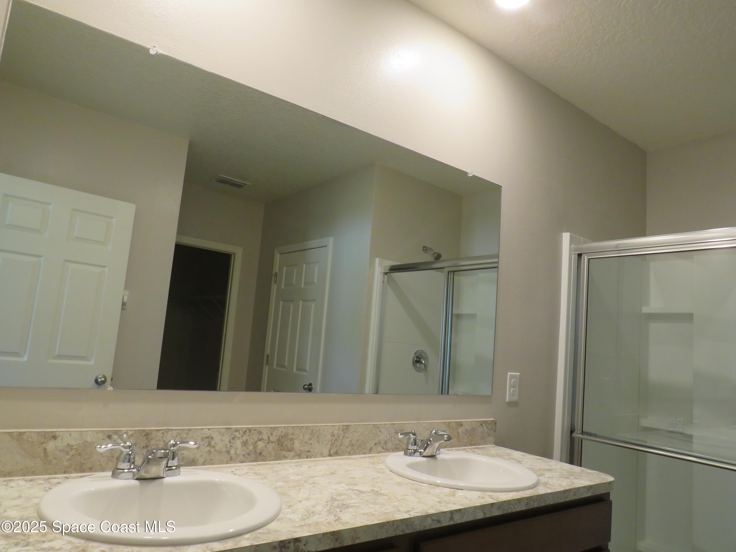 3548 Loggerhead Lane Mims, FL 32754 - Photo 15 of 25 a bathroom with a granite countertop sink and a mirror