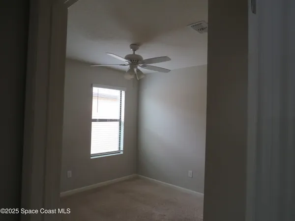 a view of a room that has a window in it