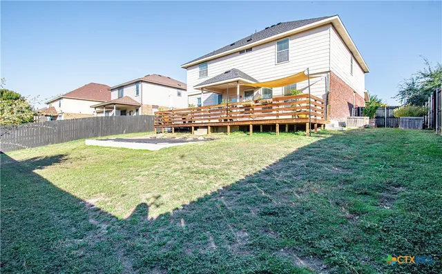 a view of a house with a big yard