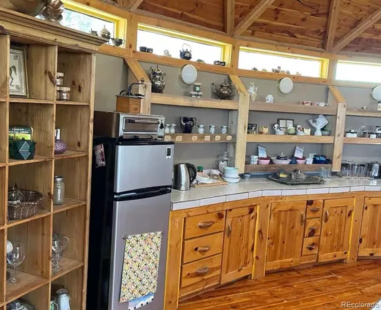 a kitchen with lots of counter top space and stainless steel appliances