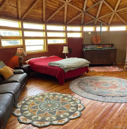 a bedroom with bed and window