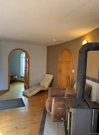 a view of living room with furniture and a large window