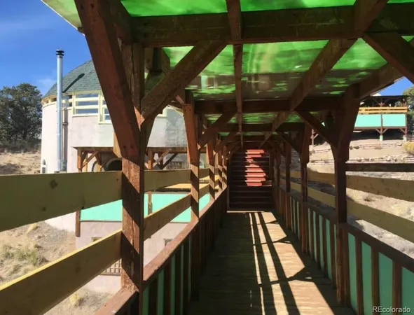 a view of balcony with wooden floor