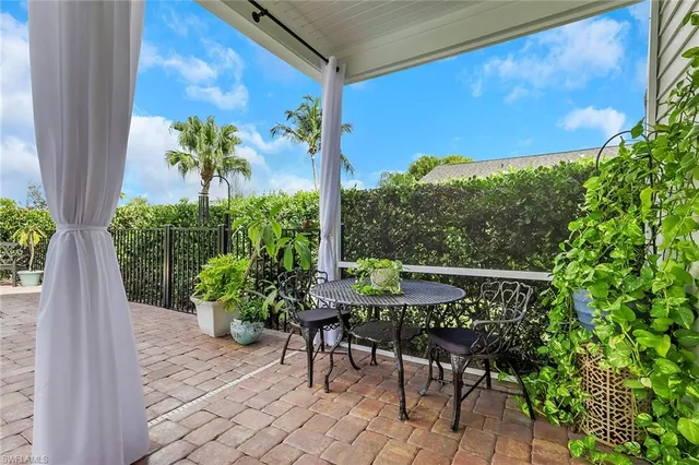 a view of a chairs and table in a patio