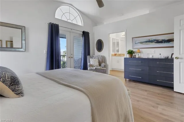 a bedroom with a bed and a mirror